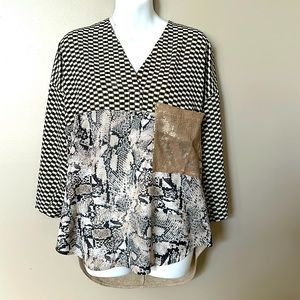 Zara top size medium. Looks great with tights and boots.